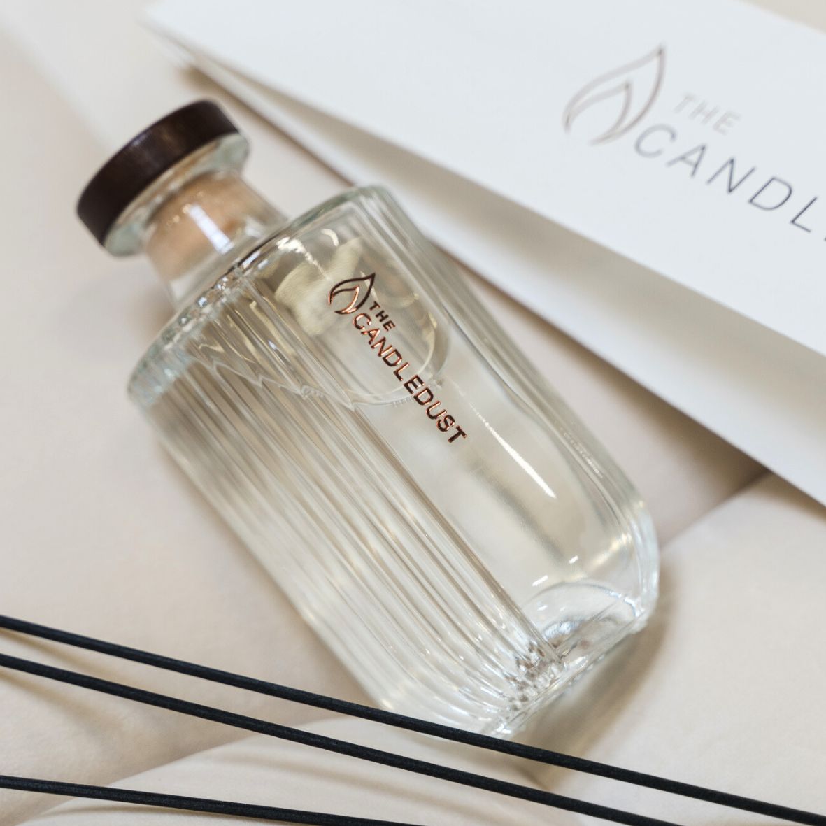 Glass room diffuser bottle with black reed sticks