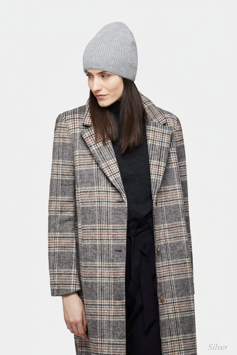 Grey ribbed beanie worn with a checked coat