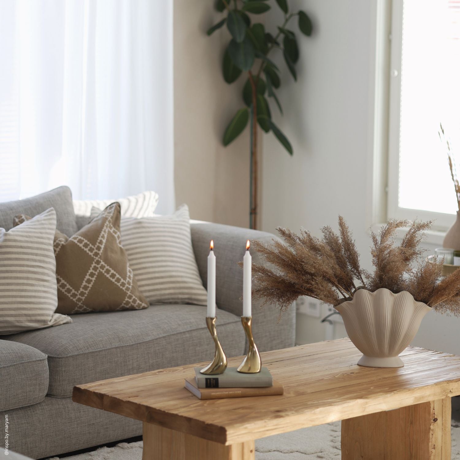 Linen cushion covers styled on a sofa in a Nordic living room