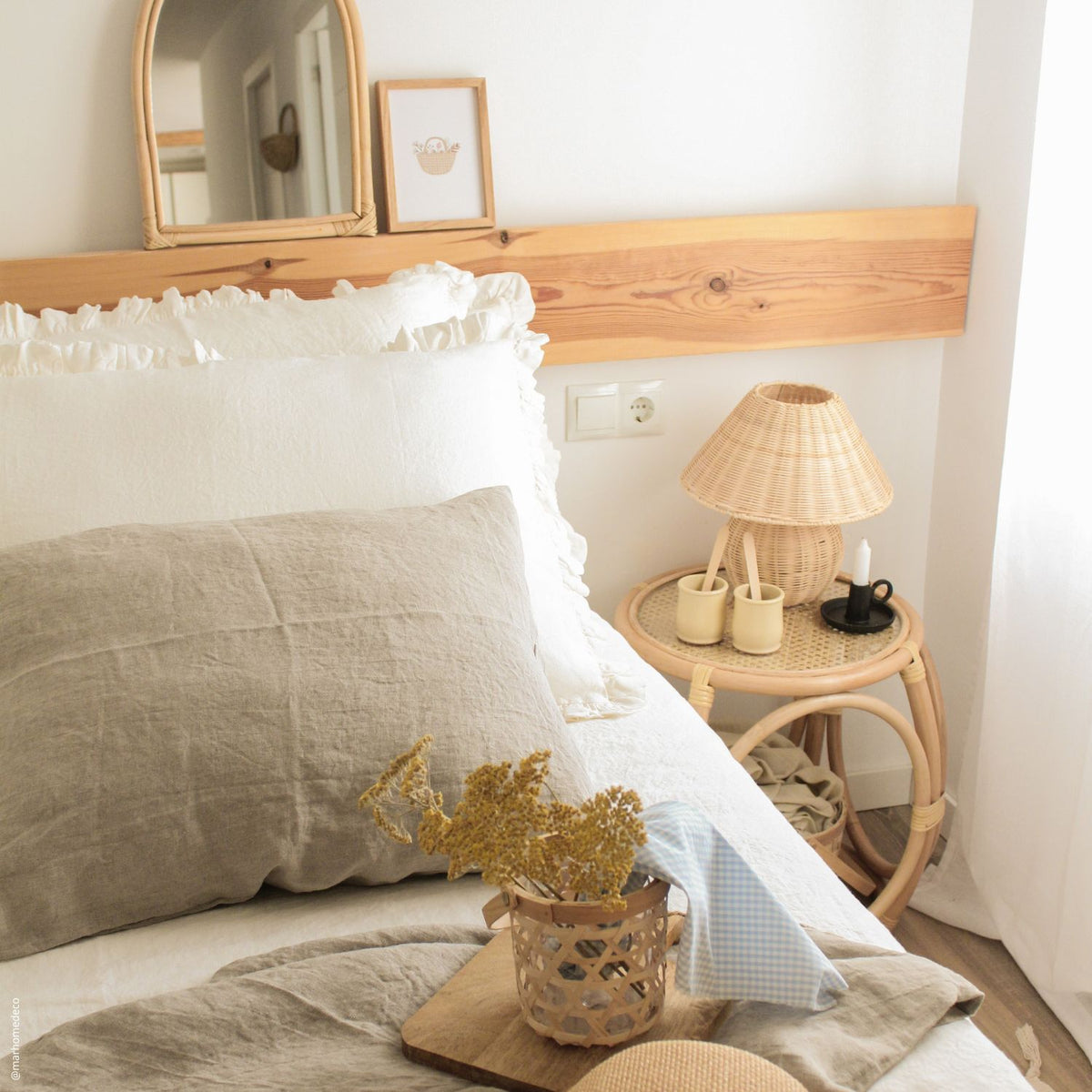 Linen pillowcases styled on a bed in a light bedroom interior