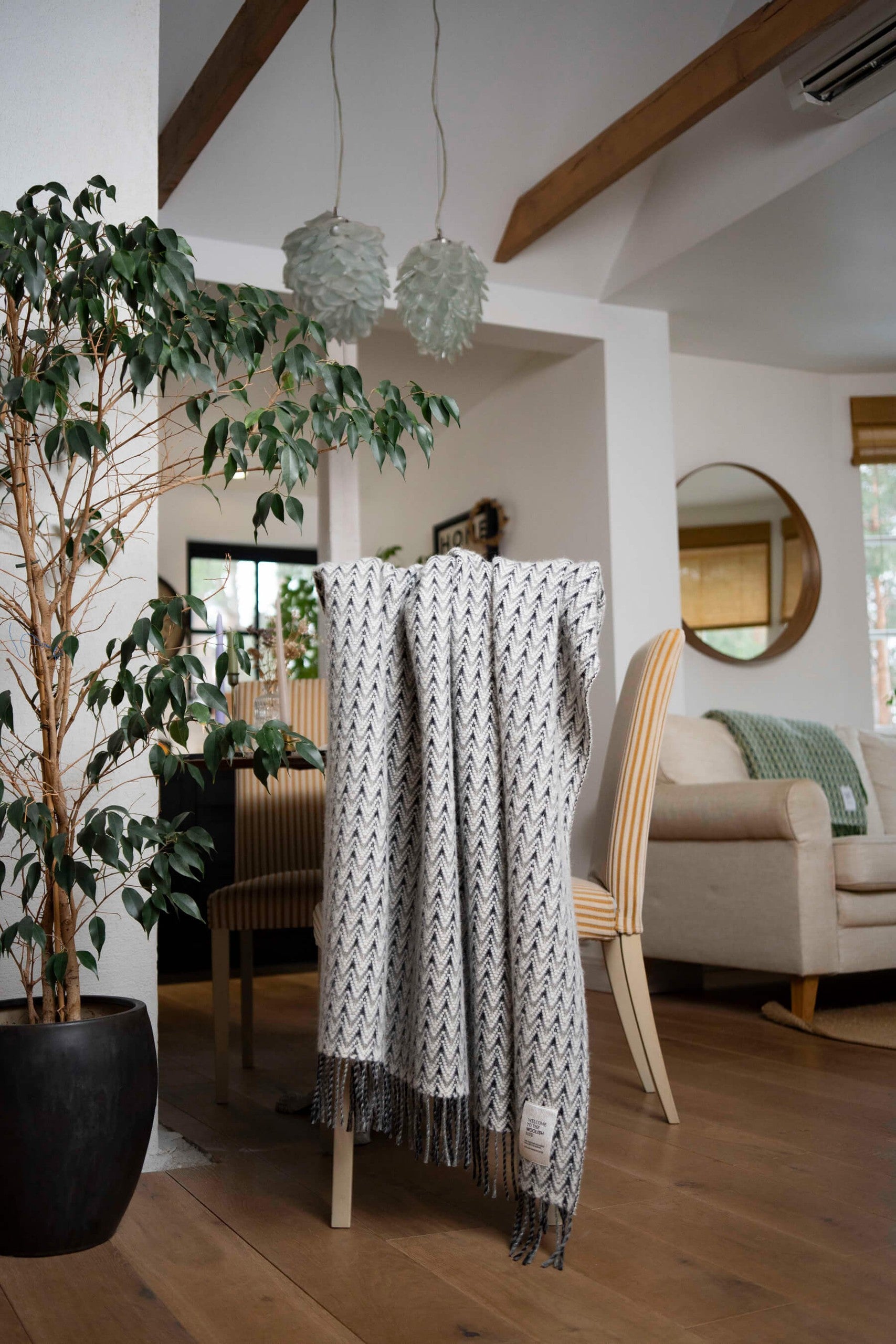 Amai wool throw draped over a lounge chair