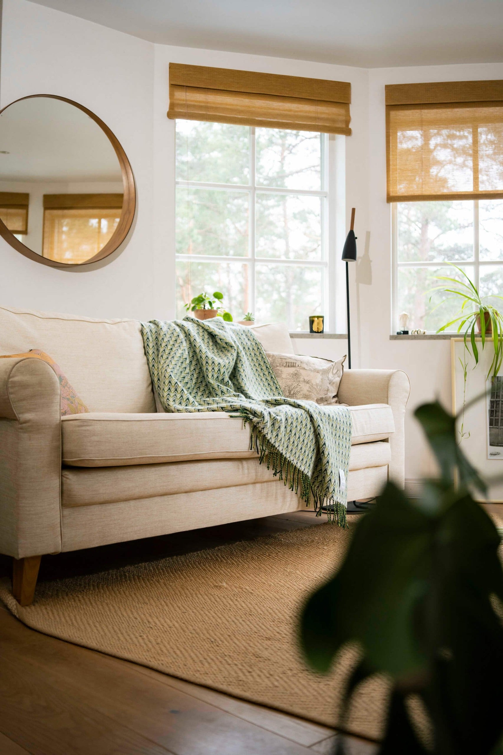 Amai wool throw styled on a sofa
