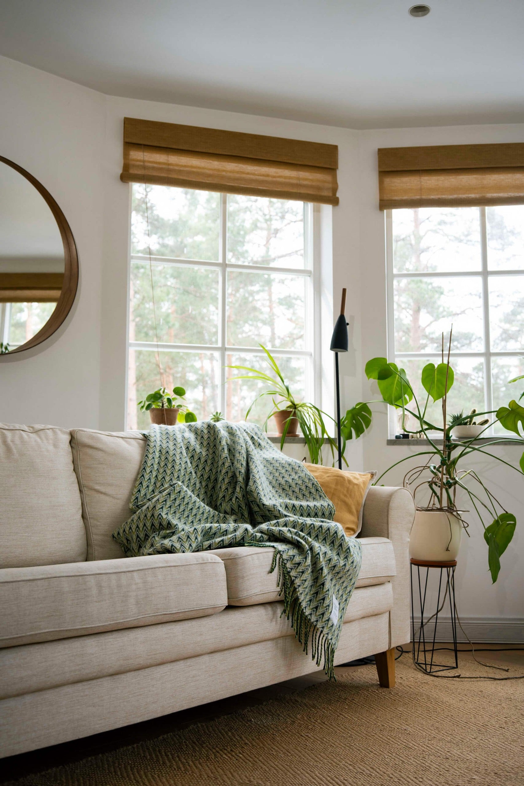 Amai wool throw styled on a sofa