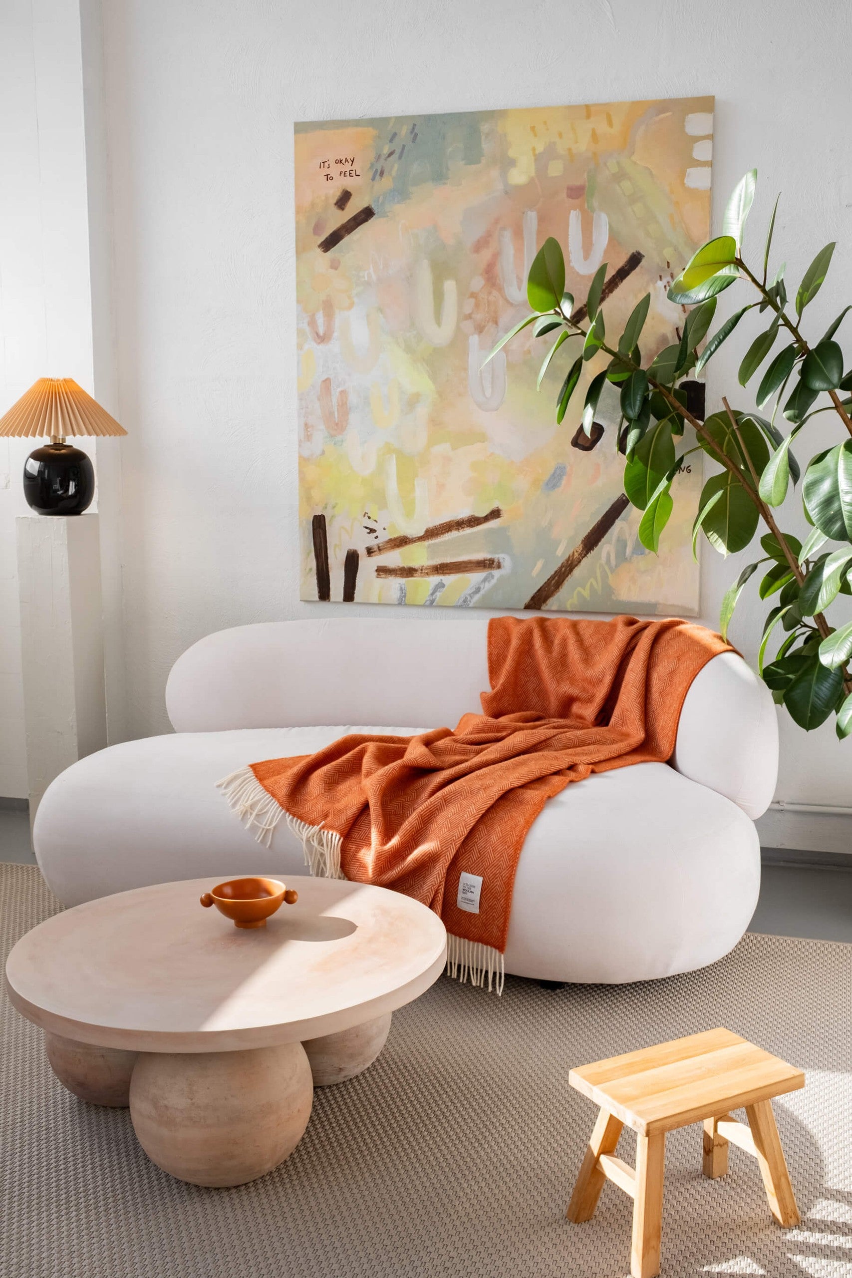 Hera pure wool throw blanket 130 x 170 cm on a white sofa