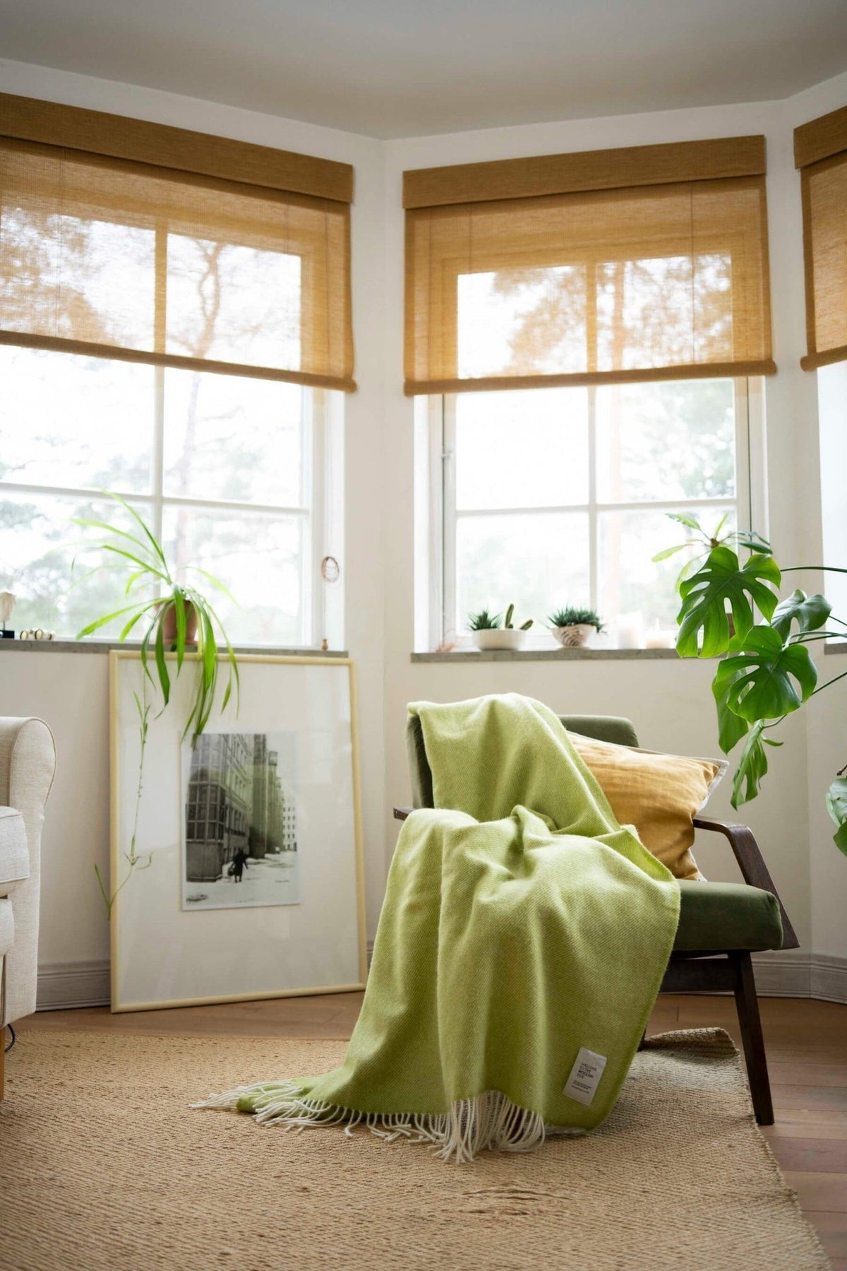 Mira wool throw in gift box draped over a lounge chair