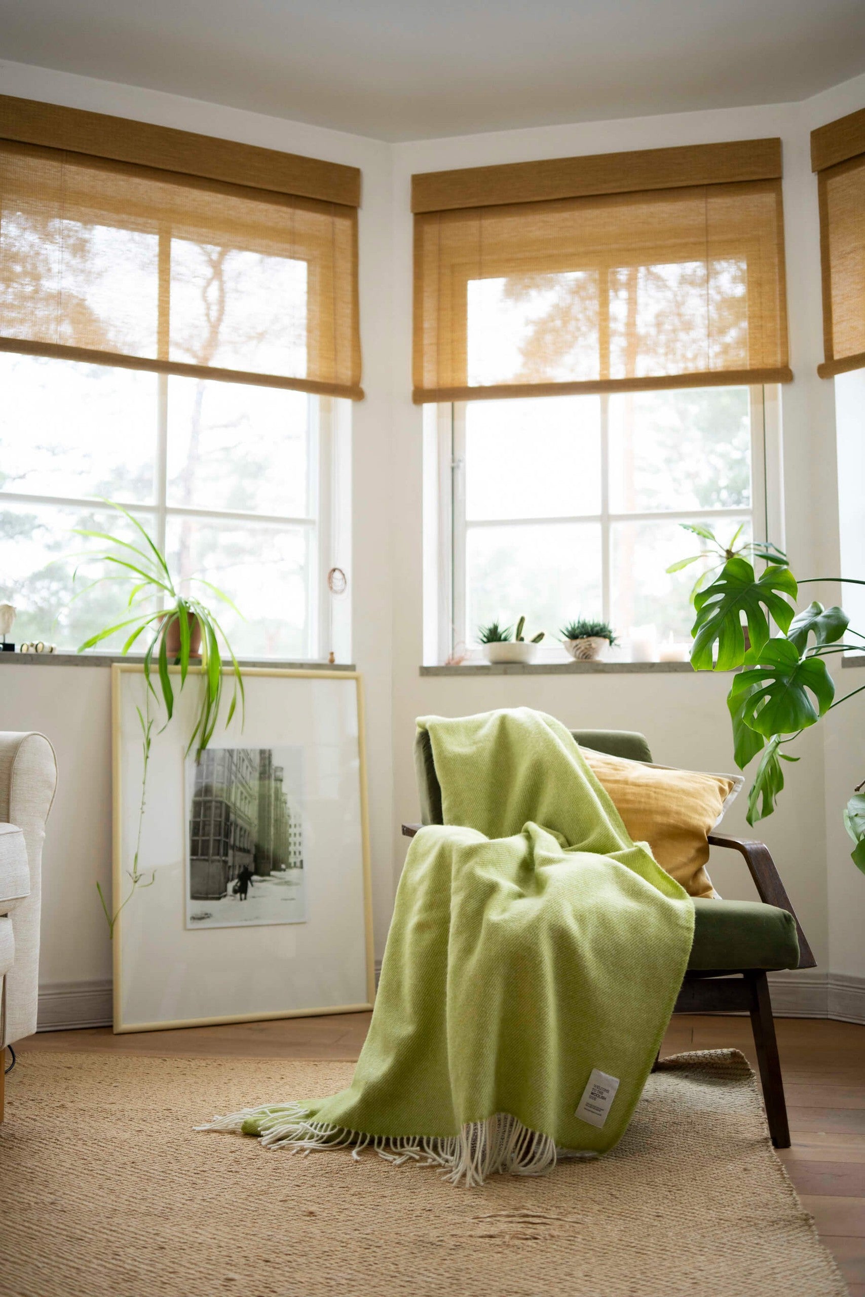 Mira wool throw in gift box draped over a lounge chair